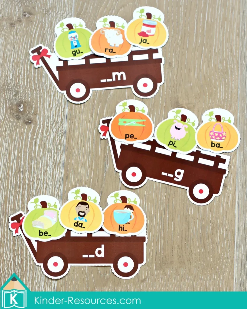 Thanksgiving Literacy Centers for Kindergarten Pumpkin CVC ending sounds sorting activity