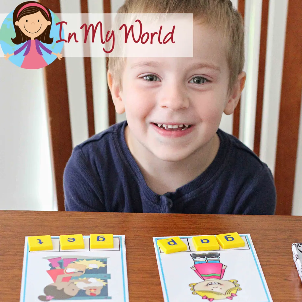 Child using letter tiles to build CVC words that start with G, practicing phoneme-grapheme mapping and spelling. Free printable activities available on the blog.
