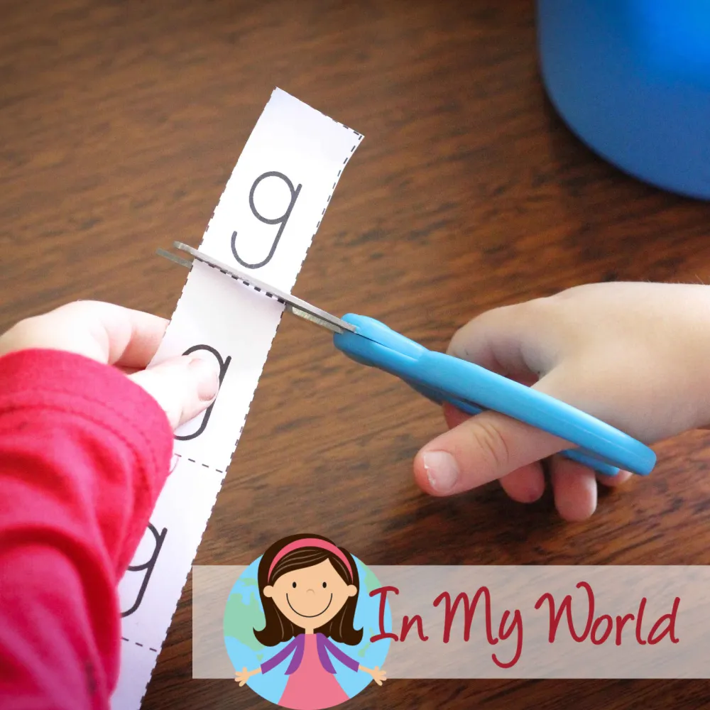 Child completing a cut and paste emergent reader for the letter G to reinforce beginning sounds and early reading skills. Free printable available on the blog.