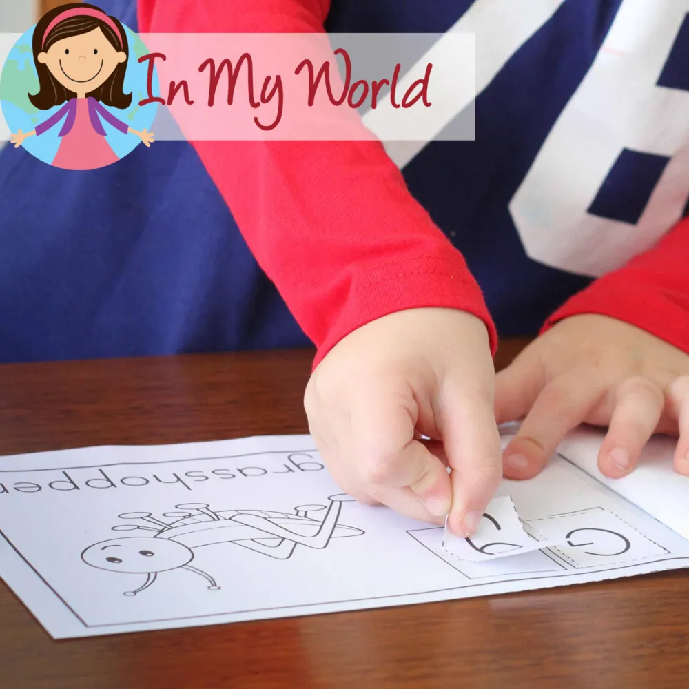 Child completing a cut and paste emergent reader for the letter G to reinforce beginning sounds and early reading skills. Free printable available on the blog.