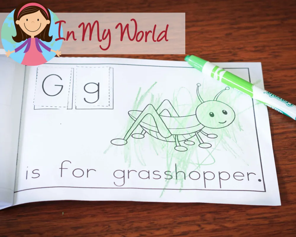 Child completing a cut and paste emergent reader for the letter G to reinforce beginning sounds and early reading skills. Free printable available on the blog.