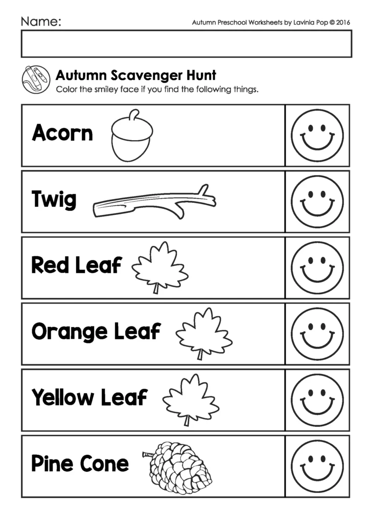 Free printable autumn scavenger hunt worksheet for preschool with pictures of acorn, twig, red leaf, orange leaf, yellow leaf, and pine cone for children to find and color smiley faces.