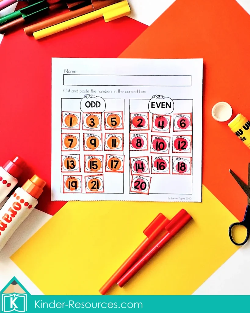 Pumpkin-themed worksheet for kindergarten where children cut and paste numbers into odd and even categories to practice number properties.
