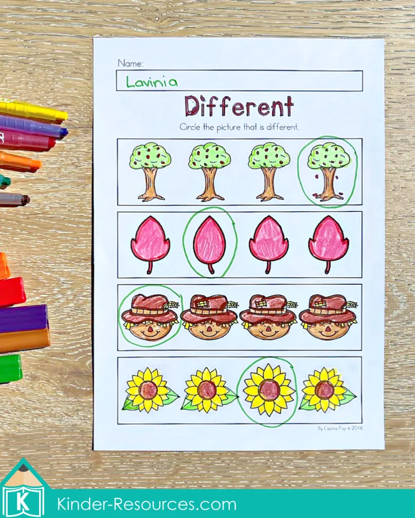 Preschool autumn worksheet for finding the different picture, including trees, leaves, scarecrows, and sunflowers.