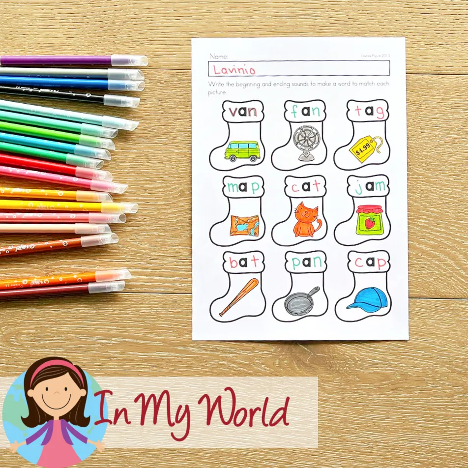 Christmas Kindergarten Worksheets and Activities CVC word worksheet with Christmas stockings featuring picture prompts and beginning and ending sounds for kids to complete words