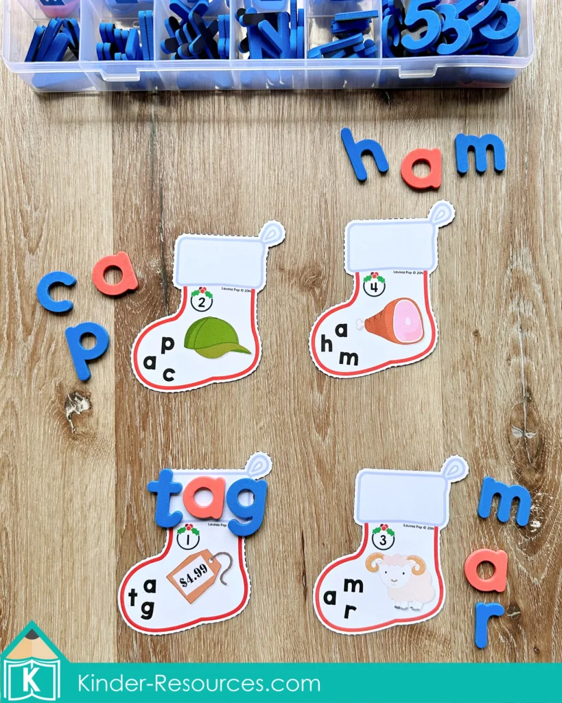 CVC stocking cards for Christmas Literacy Centers for Kindergarten where children build words such as cap tag ham and mar