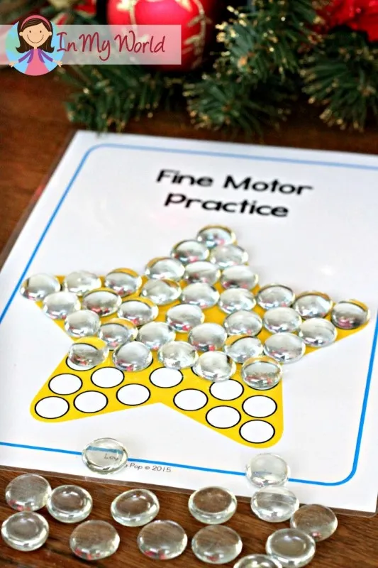 Fine motor Christmas star practice mat from the Christmas Nativity Centers for Preschool with circles for placing pom poms, gems, or small objects.