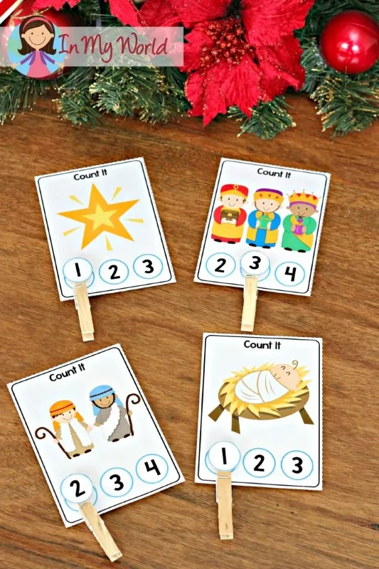 Christmas counting clip cards from the Christmas Nativity Centers for Preschool for clipping the number that matches the set of pictures.