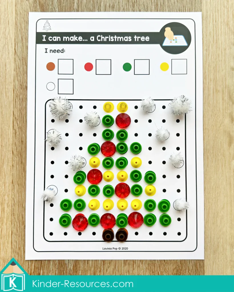 Christmas pegboard mosaic puzzle Christmas tree design built using green beads, red gems, yellow beads, and white pom poms on the pegboard activity card.