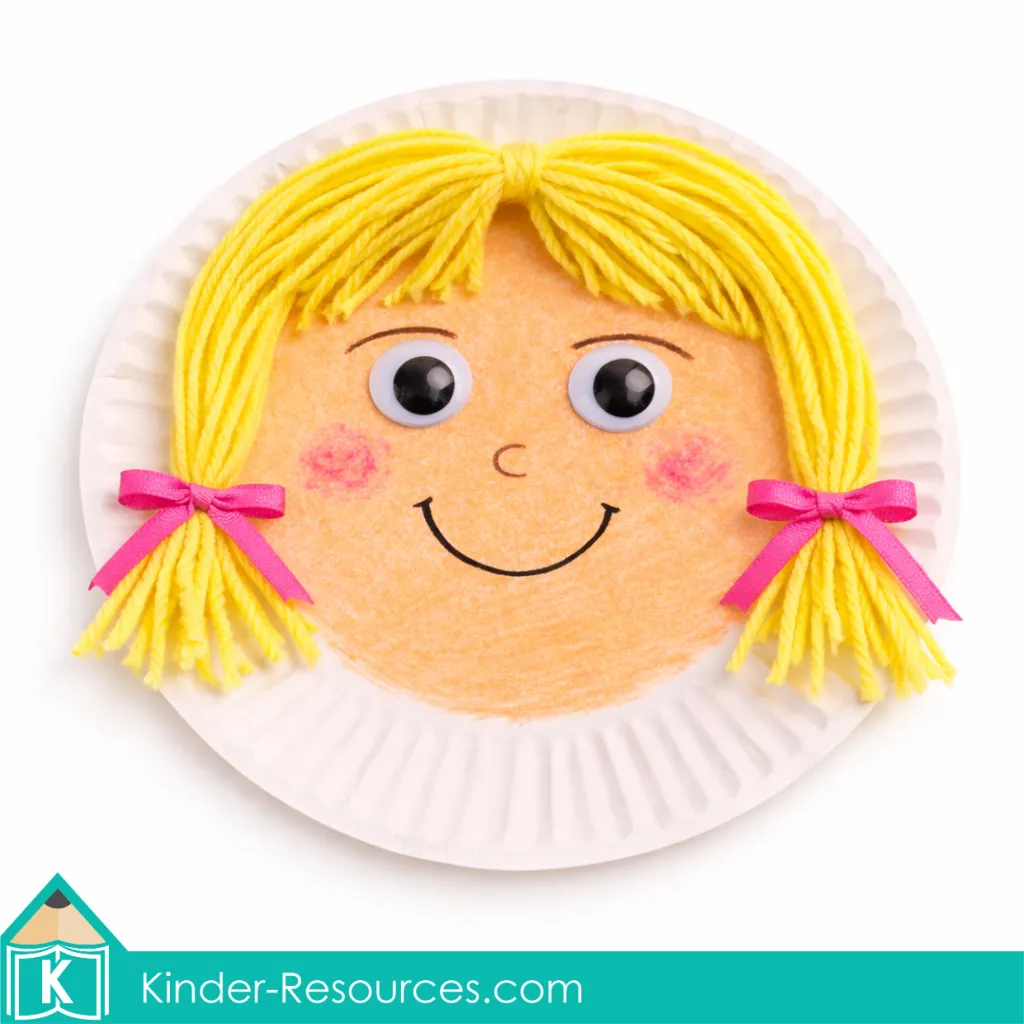God Made People girl paper plate craft with drawn facial features yarn hair and ribbon bows for a preschool Bible lesson