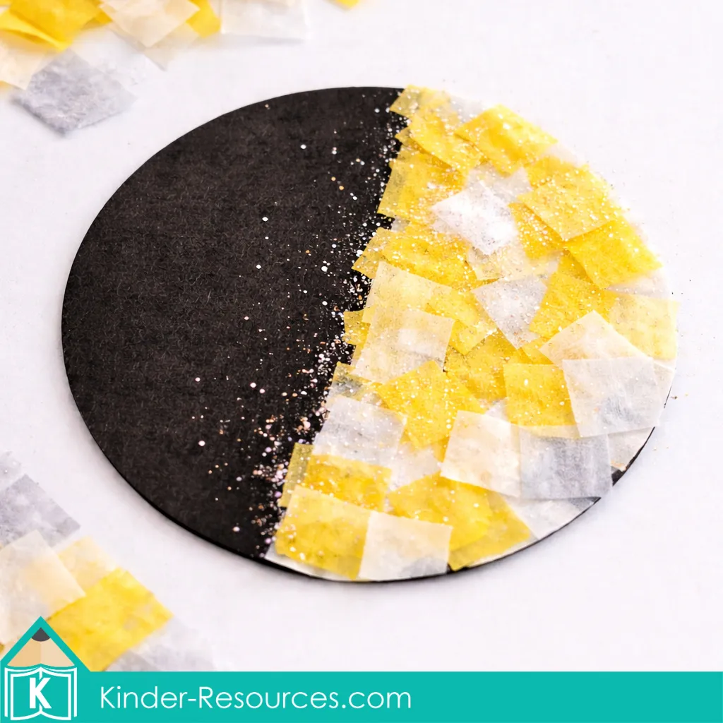 Preschool Creation craft showing light and darkness using tissue paper on black construction paper