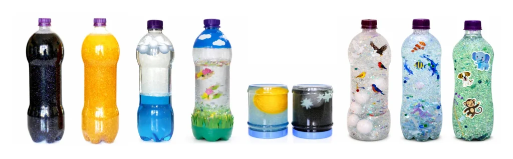 Creation sensory bottles for preschool showing light and dark, sun and moon, sky and plants, birds, fish, and land animals from the Creation story