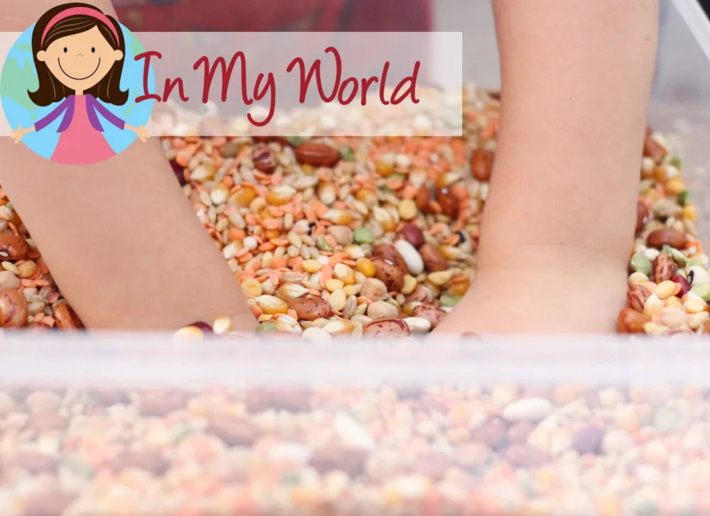 Preschool Letter F printable activities sensory bin with child’s hands exploring mixed beans for letter sound learning