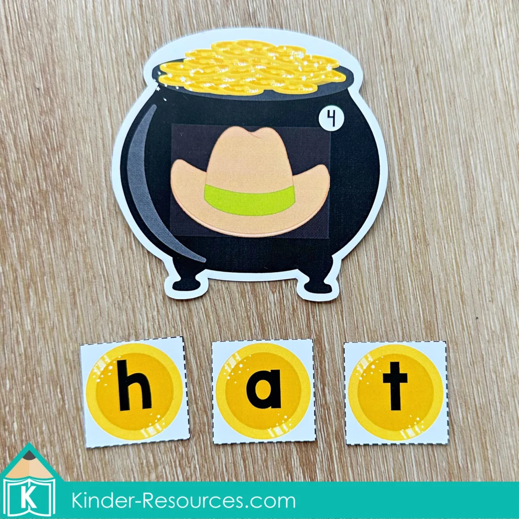 St. Patrick’s Day Literacy Centers for Kindergarten March Morning Tubs unscramble the sight word activity with pot of gold mats and letter coin cards spelling pad, ram, fan, and hat.