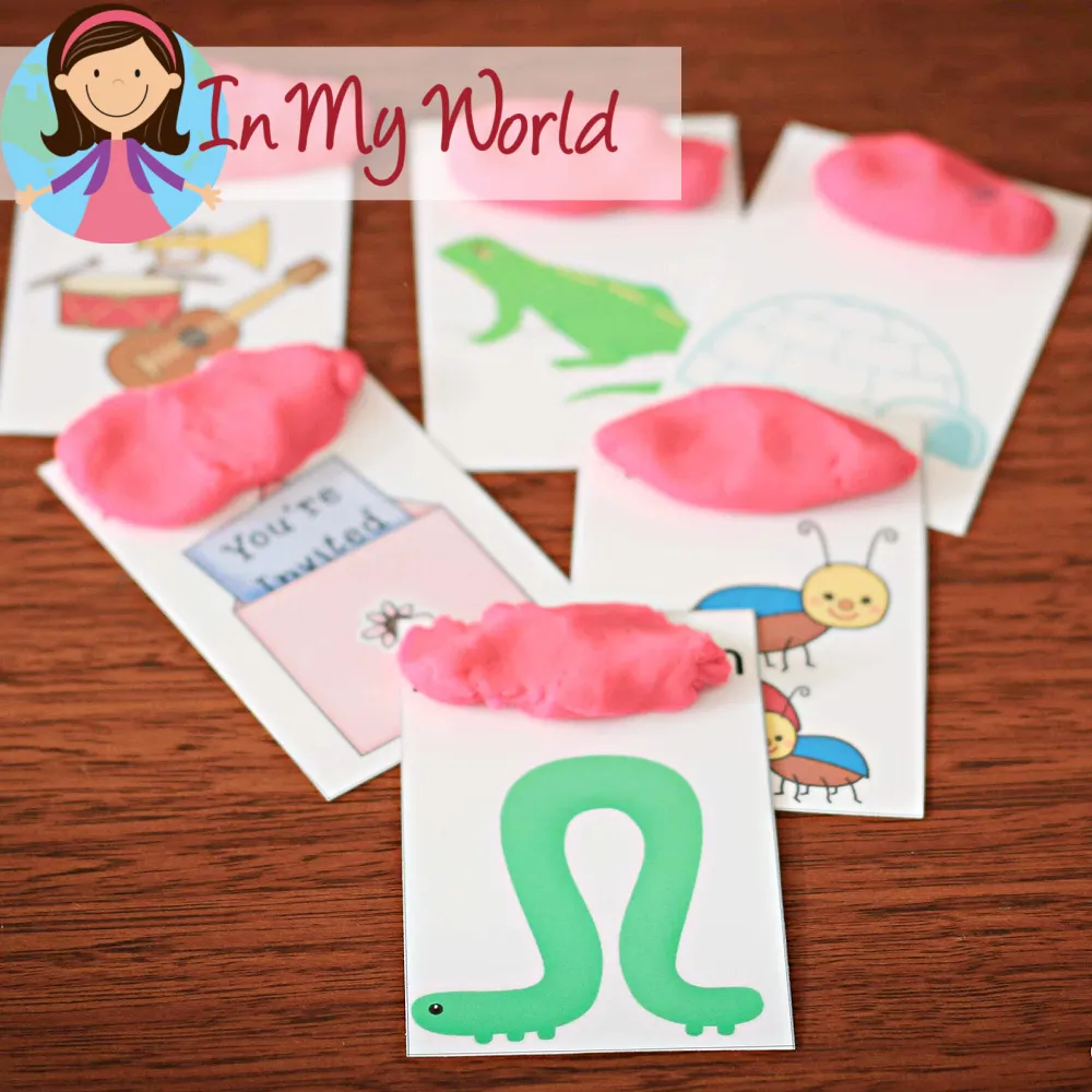 Preschool Letter I activities using beginning sounds vocabulary cards with playdough covering words for phonics practice