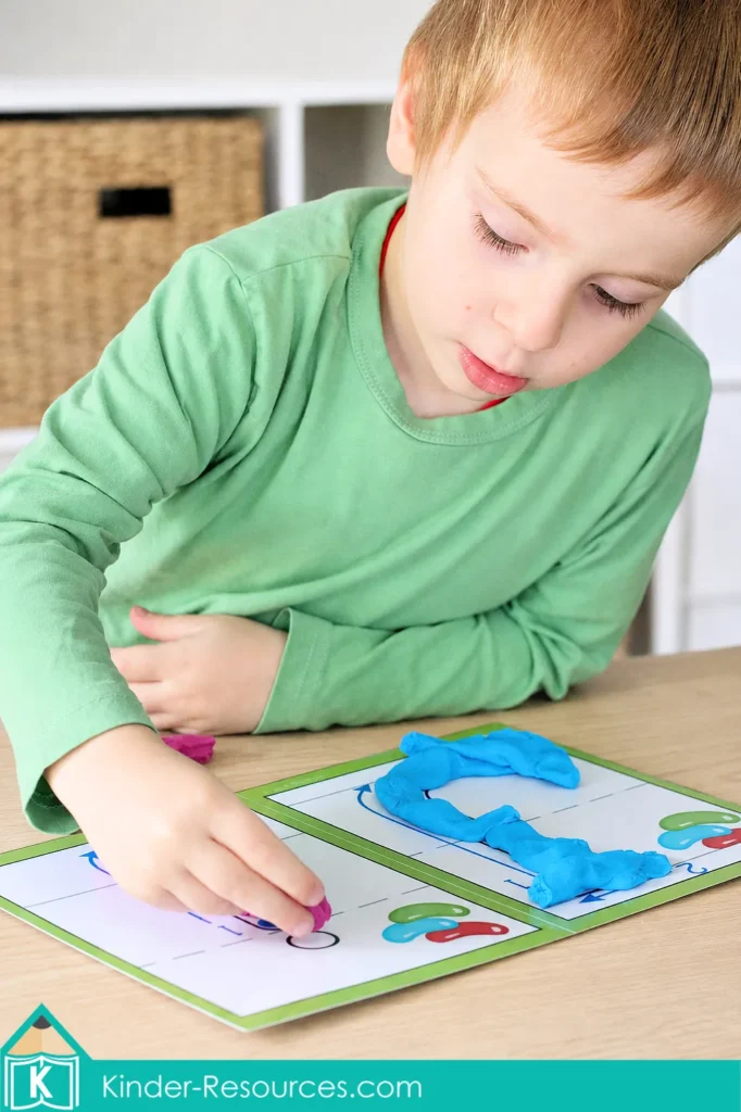 Preschool Letter J activities using blue and pink play dough to form uppercase and lowercase J on reusable alphabet mats.