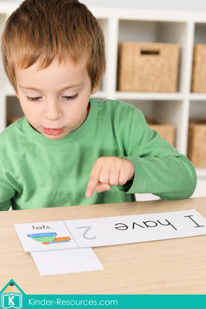 Preschool number 2 activity with the sentence “I have 2 hats” and clothing picture cards for coats, mittens, boots, and scarves.