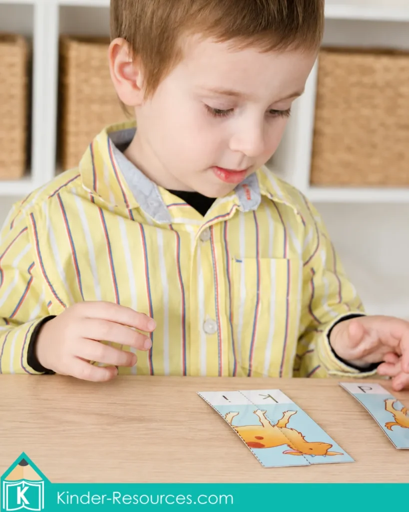 Child matching segmented picture and letter cards to build the word kid during preschool letter K phonics practice.