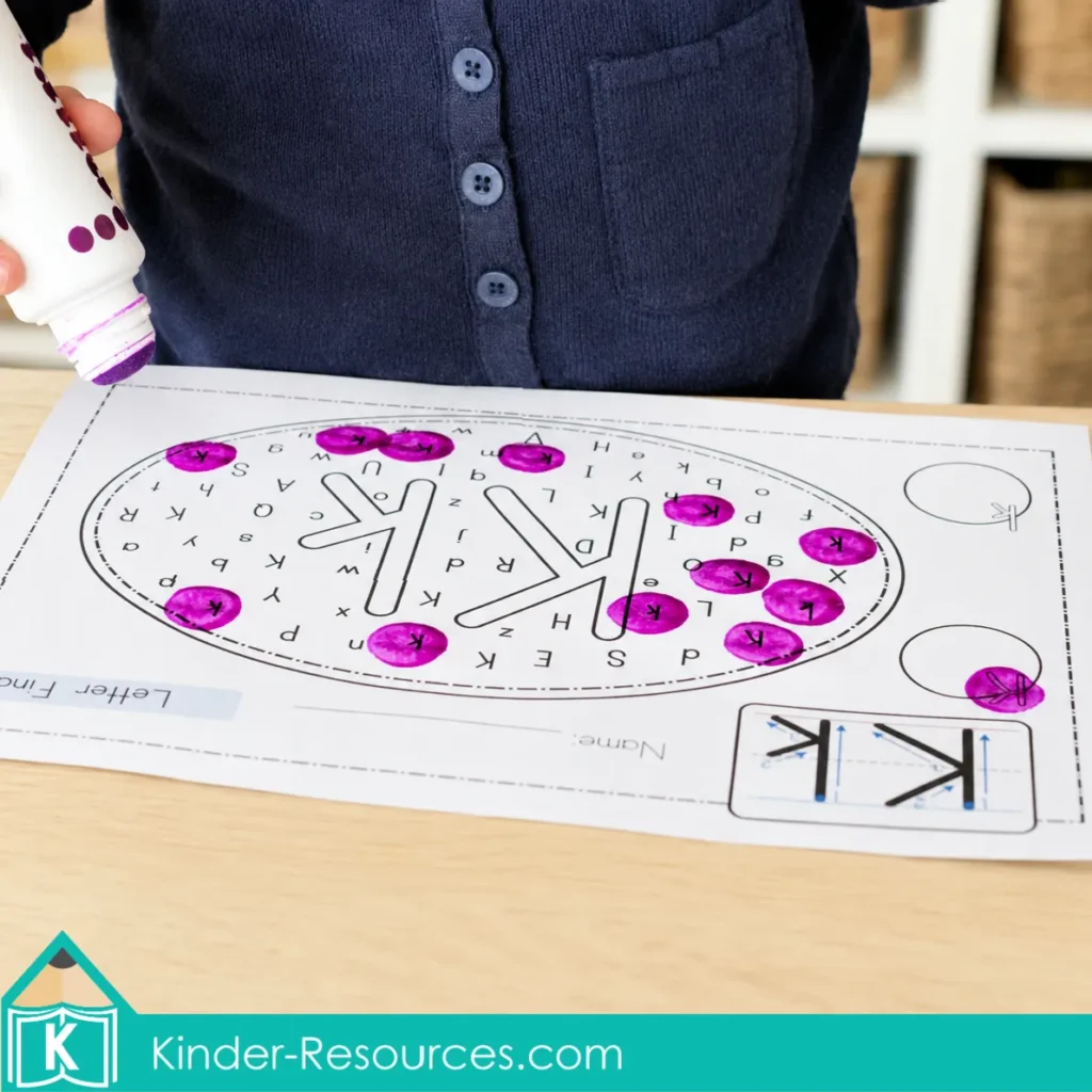 Preschool letter K letter find worksheet completed with a purple bingo dauber for uppercase and lowercase K recognition practice.