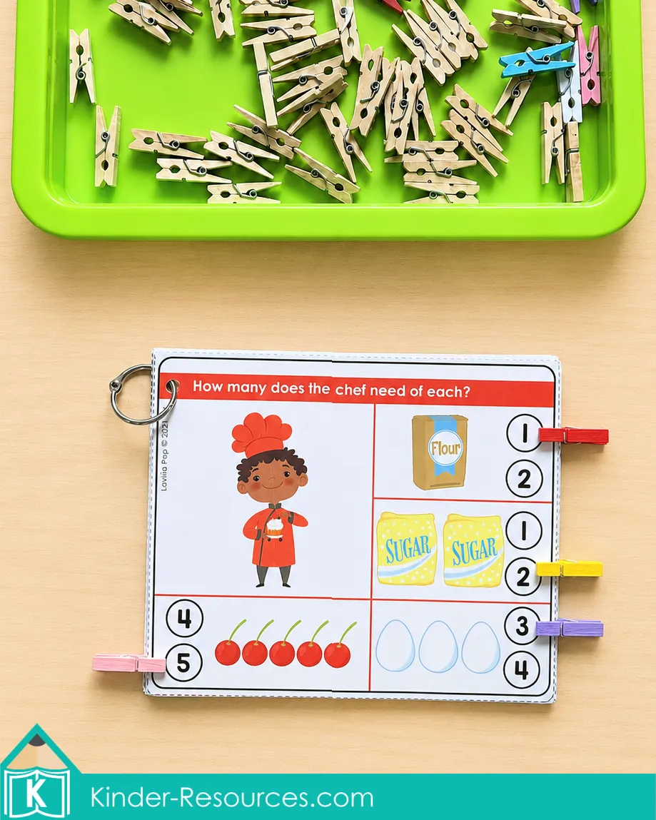 Counting flour, sugar, cherries, and eggs on a chef-themed clip card and clipping the correct numerals.
