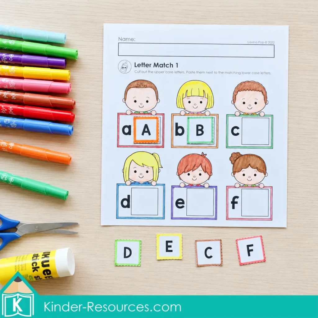 Matching uppercase letter cards A to F with lowercase letters on a cut and paste first grade alphabet worksheet.