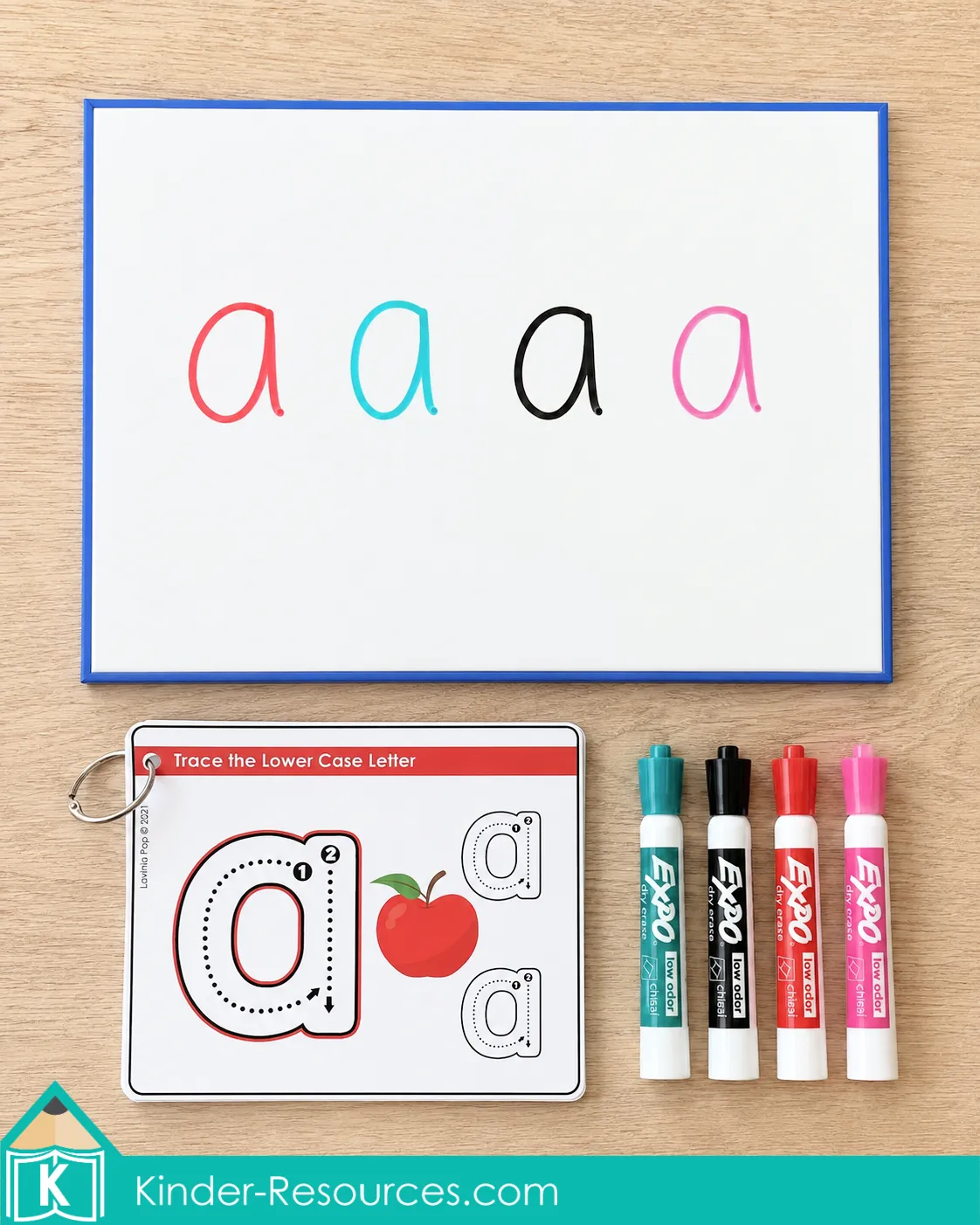 Using a lowercase letter a tracing card and dry erase board to practice writing lowercase a with colorful markers.