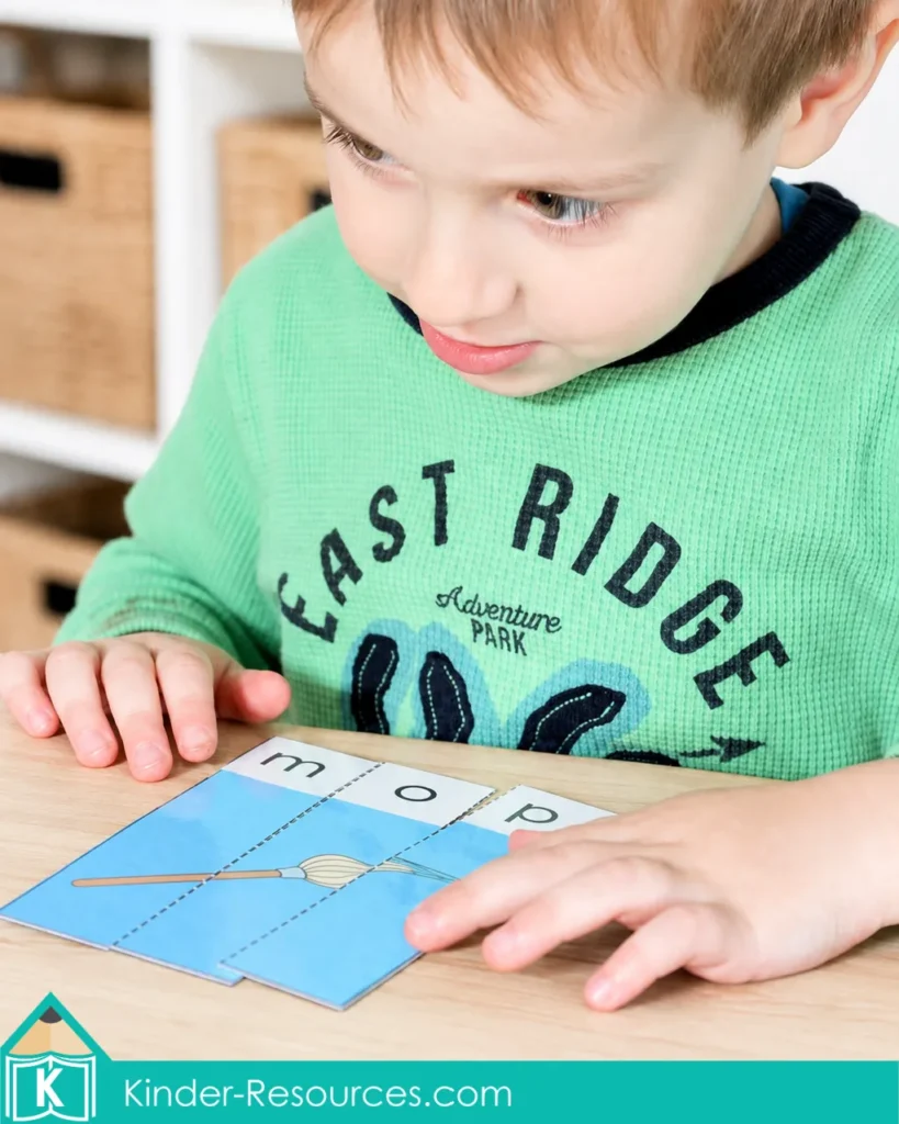 hild assembling a three piece mop CVC word puzzle with lowercase m, o, and p for preschool phonics and word building practice.