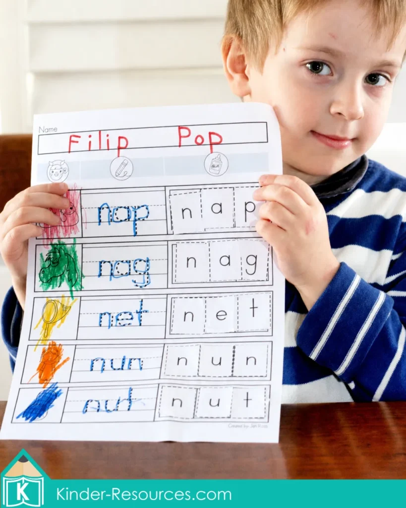 Preschool child holding a completed Letter N CVC worksheet featuring nap, nag, net, nun and nut.