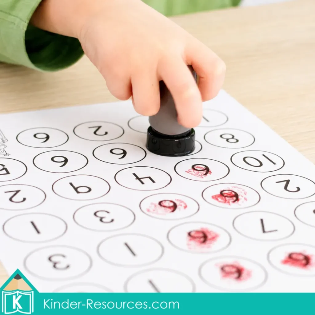 reschool child using a stamp to find and stamp the number 6 on a number-recognition worksheet.