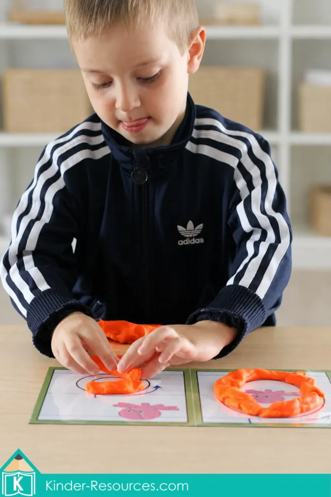 Using printable play dough mats to form uppercase O and lowercase o with orange playdough.