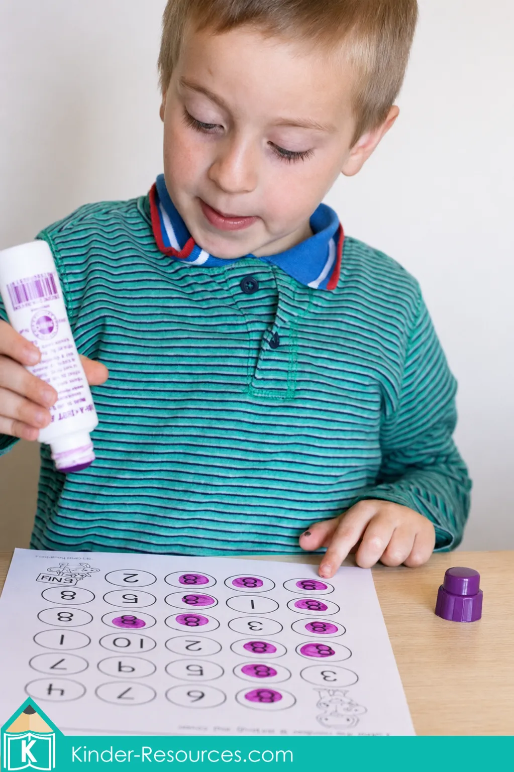 Using a dot marker to follow the number 8 maze for numeral recognition and fine motor practice.
