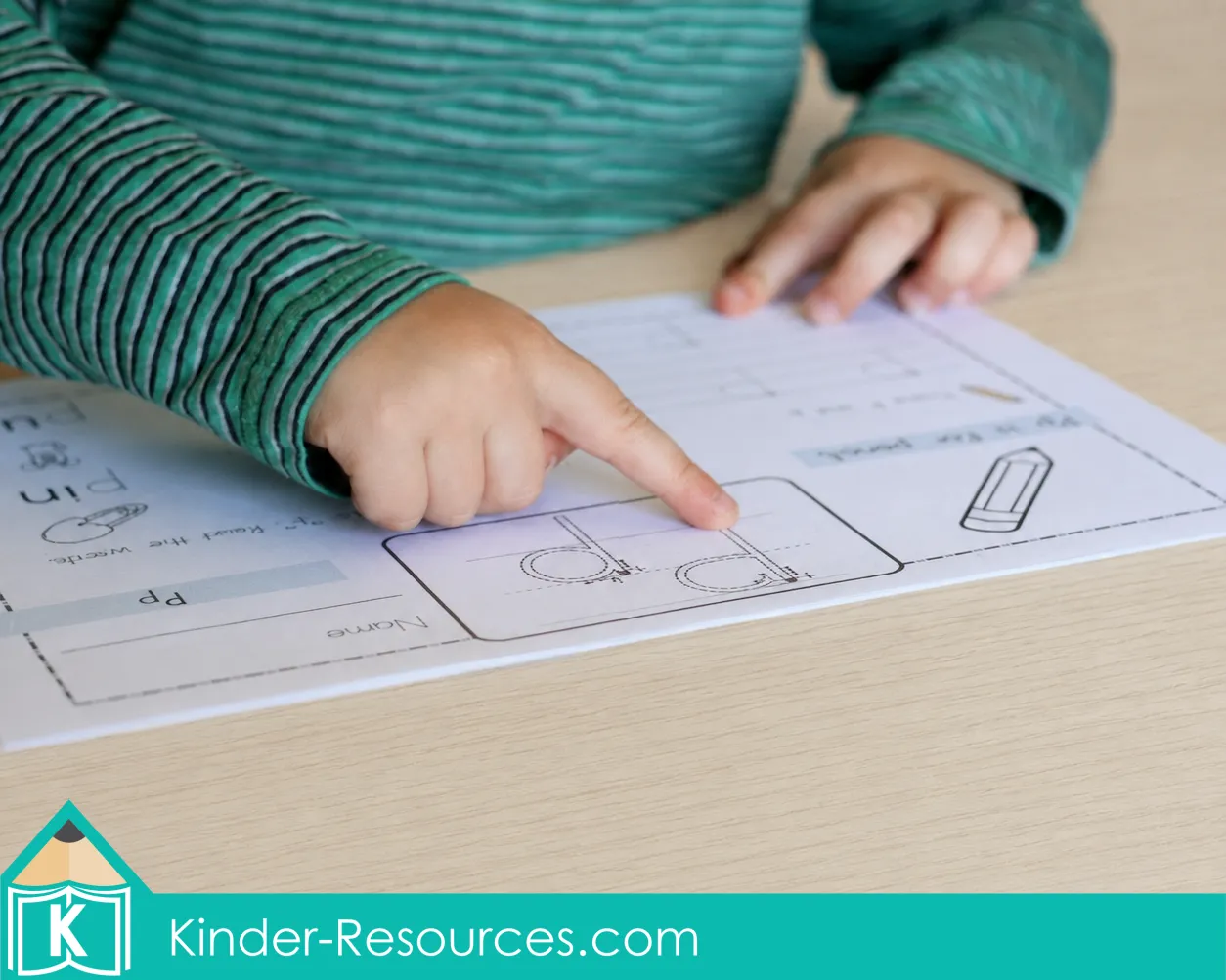 Finger tracing a large letter P on a printable preschool alphabet worksheet before handwriting practice.