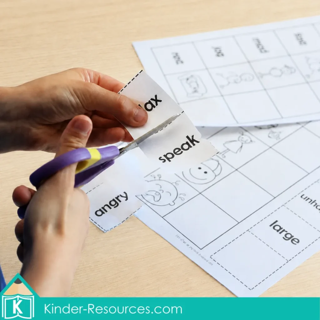 Cutting synonym word cards apart for a free synonyms activity about words with similar meanings.