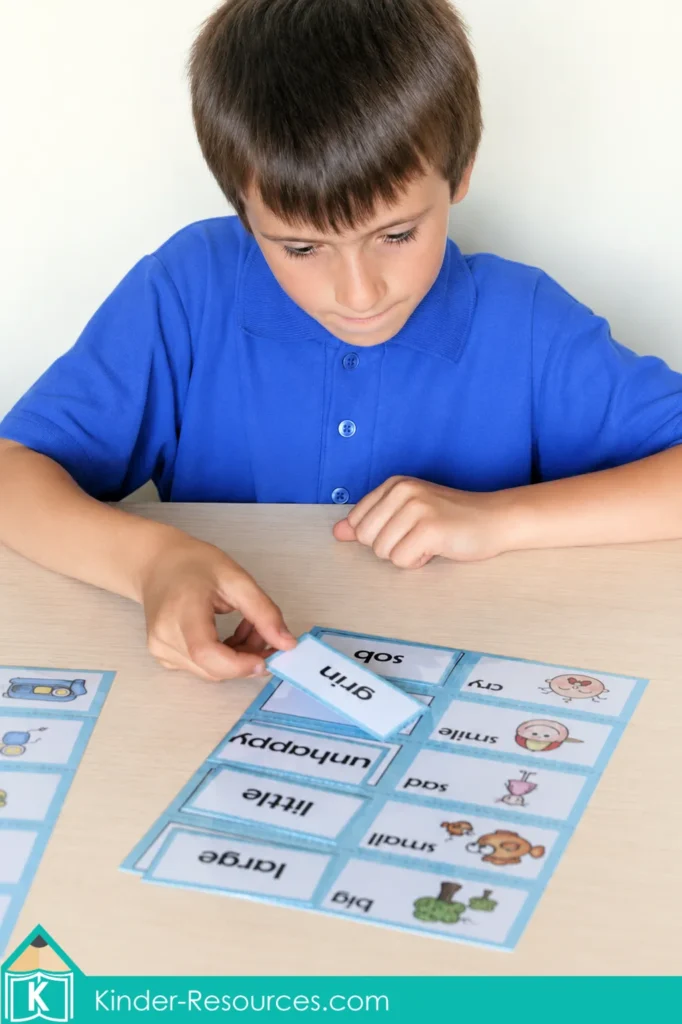 Matching synonym word cards to picture mats during a hands on free synonyms activity.