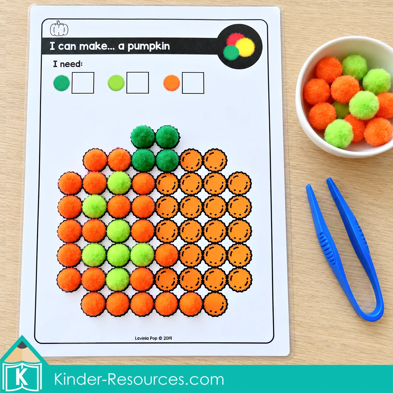 October fine motor morning tubs pumpkin pom pom activity for preschool using colorful pom poms to develop color matching, hand strength, and fine motor precision.
