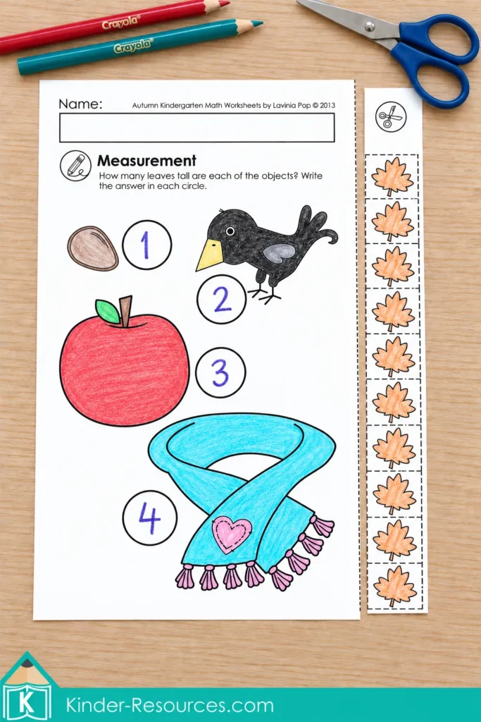 Kindergarten nonstandard measurement worksheet using autumn leaves to measure objects including an apple, bird and scarf.