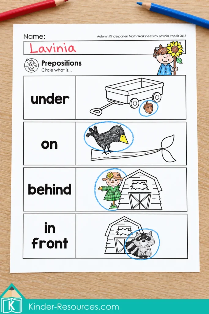 Autumn kindergarten positional words worksheet practicing under, on, behind and in front with seasonal pictures.