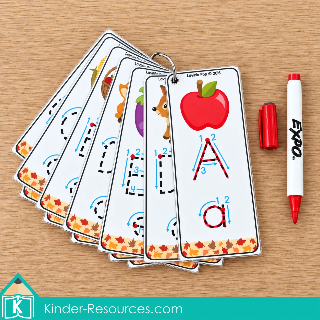 Alphabet tracing cards for fall preschool centers on a binder ring, with uppercase A and lowercase a traced in red.