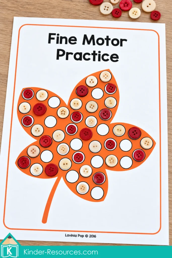 Orange leaf fine motor mat for fall preschool centers with red and cream buttons placed over its circles.