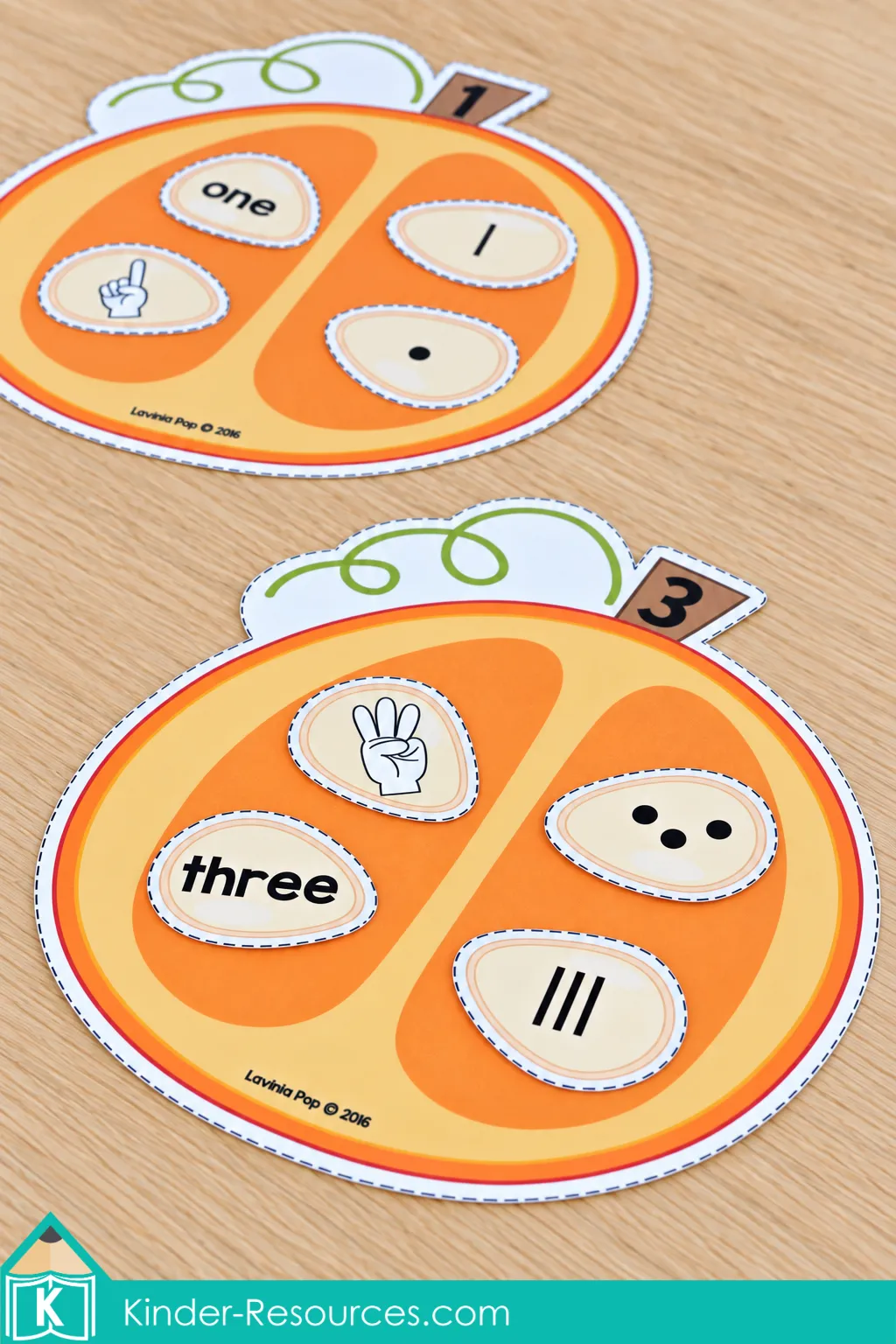 Pumpkins numbered 1 and 3 for fall preschool centers with seed pieces showing dots, tally marks, number words, and fingers.