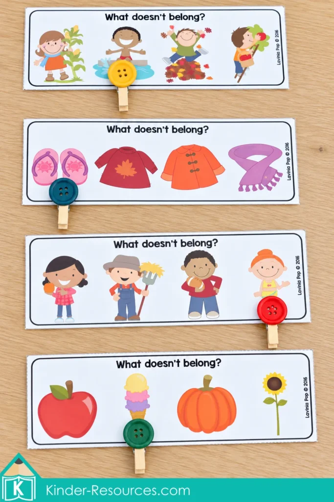 Classification cards for fall preschool centers with button-topped clothespins marking the pictures that do not belong.