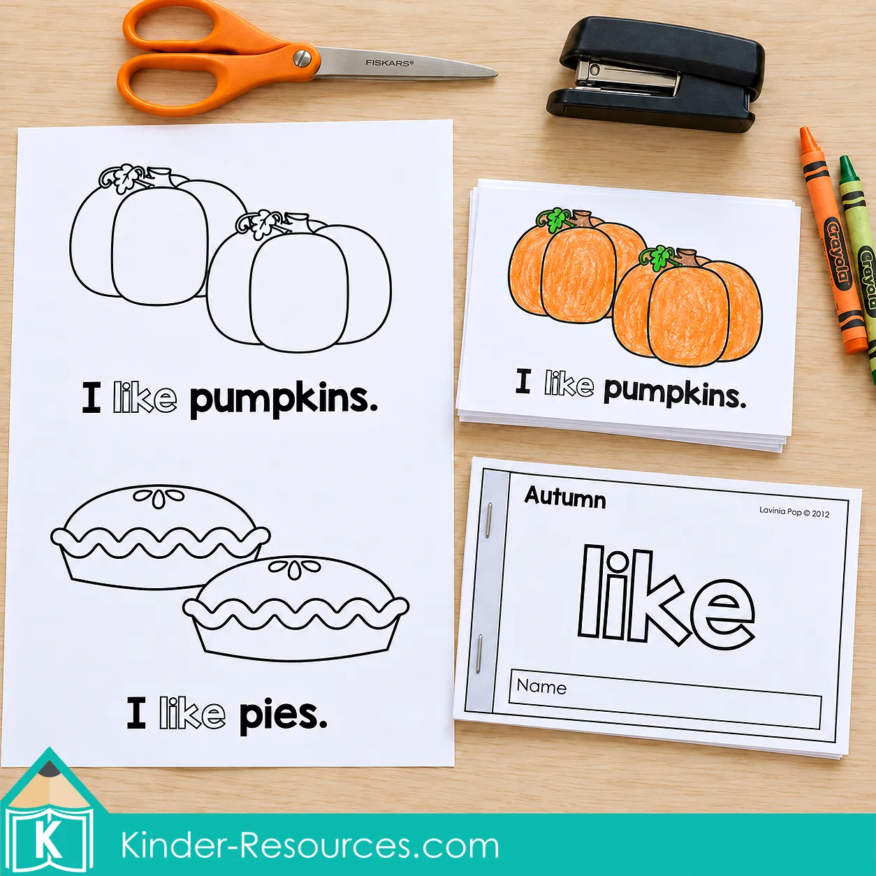 Autumn reader printout, trimmed pumpkin pages, and stapled “like” booklet with scissors, a stapler, and crayons.
